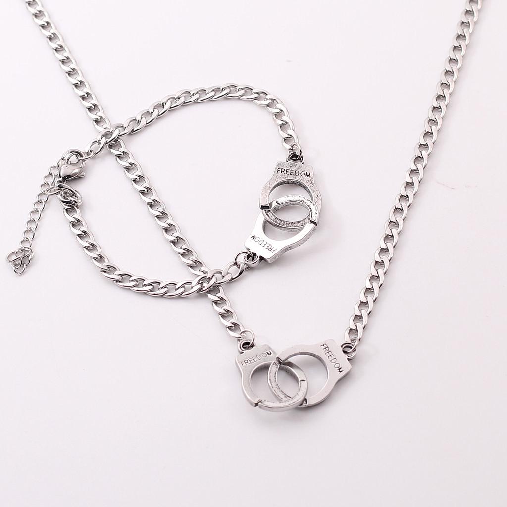 COL1414	Collar y Pulsera Acero plateada Esposas